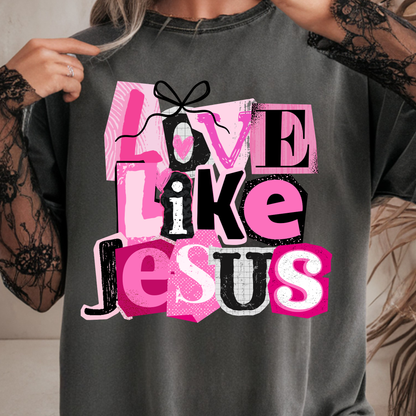 Person wearing a comfort color pepper t-shirt with 'Love Like Jesus' text design.