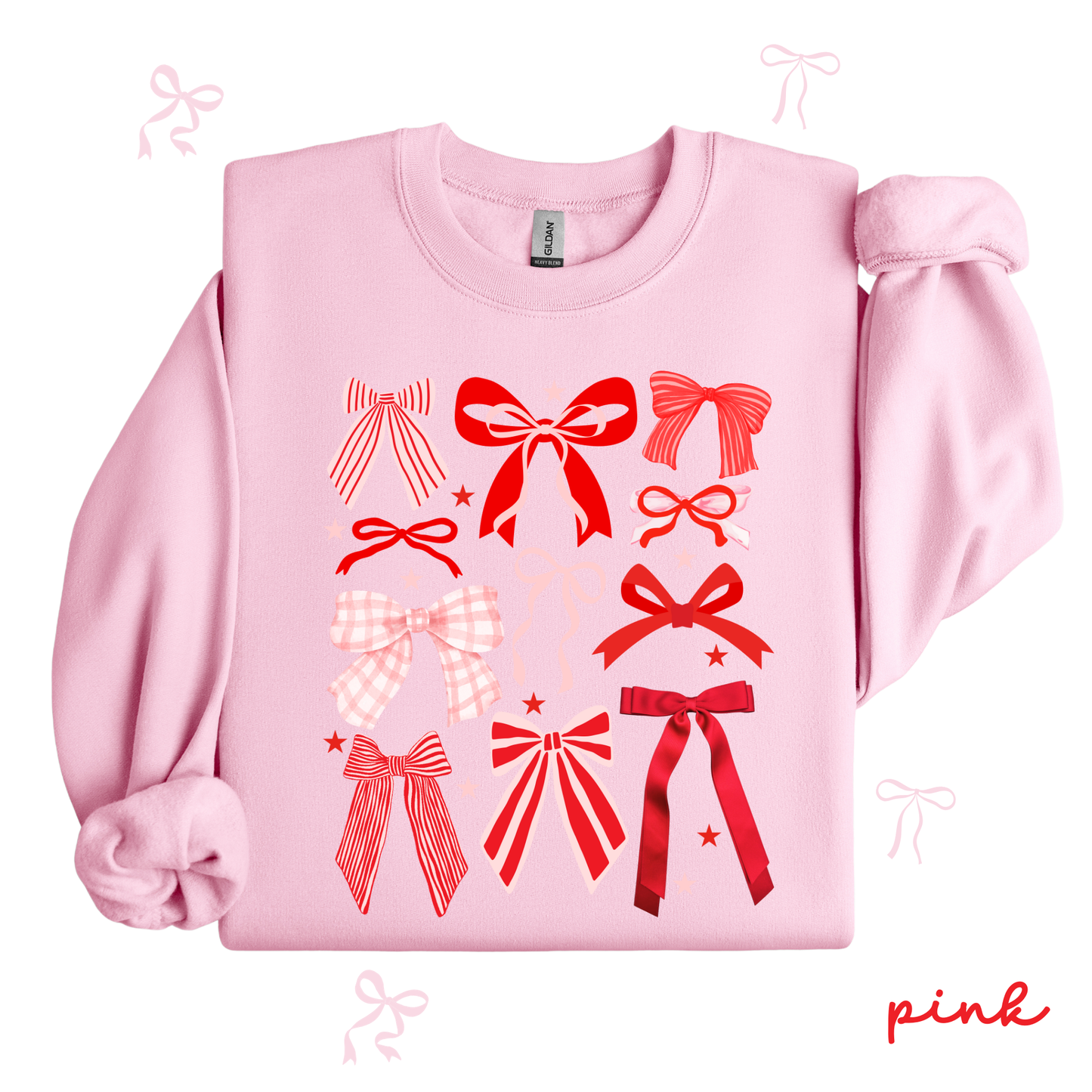 Pink sweatshirt with red bow designs on a white background