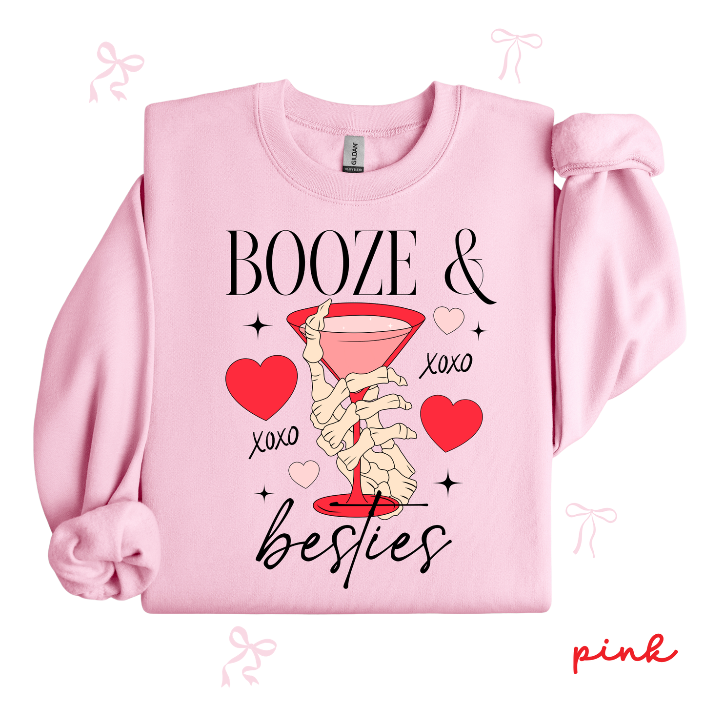 Pink sweatshirt with skeleton hand, martini glass, and text 'Booze & Besties' on a white background.