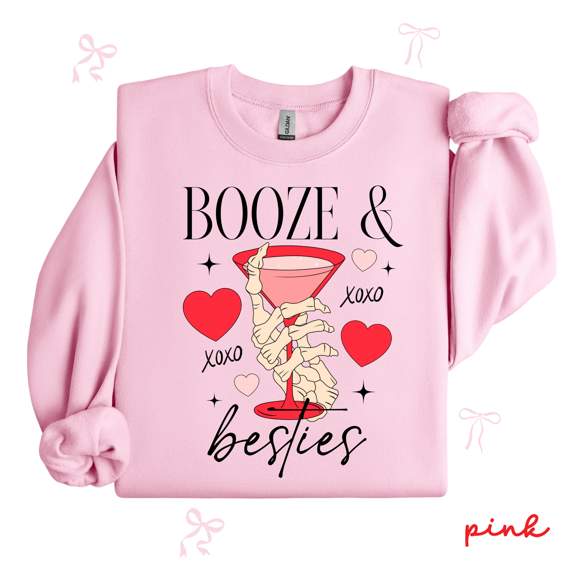 Pink sweatshirt with skeleton hand, martini glass, and text 'Booze & Besties' on a white background.