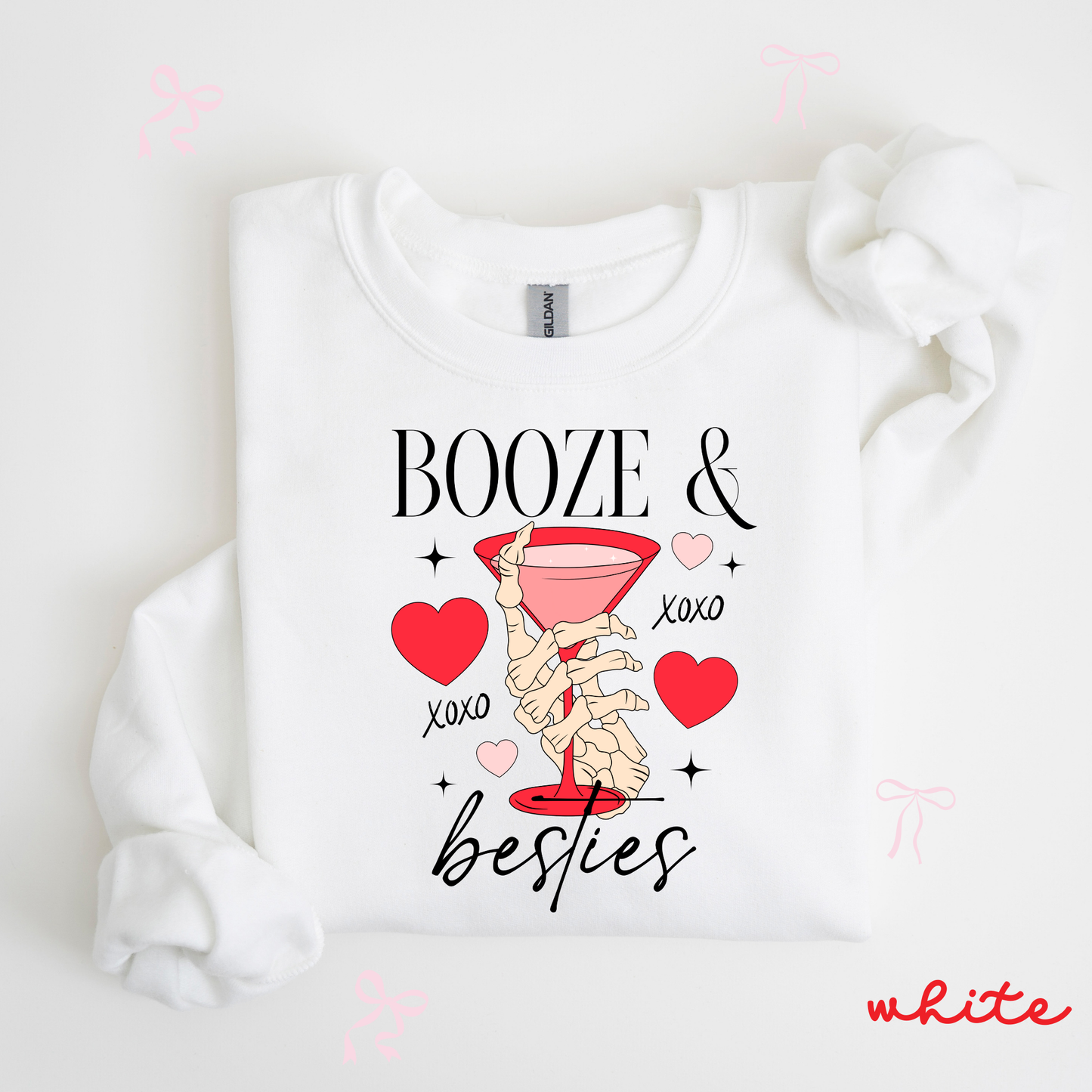 White sweatshirt with 'Booze & Besties' text and graphics on a white background