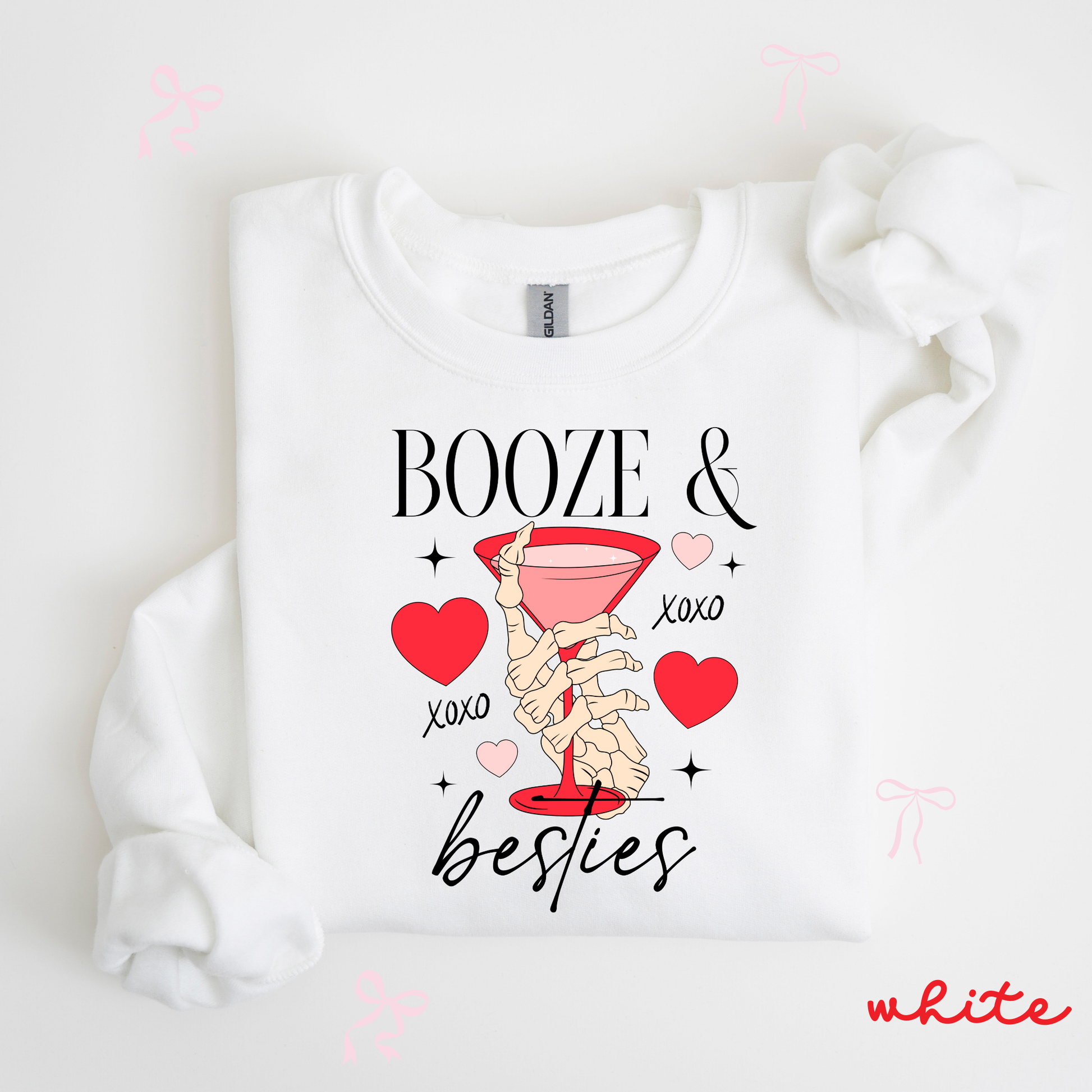 White sweatshirt with 'Booze & Besties' text and graphics on a white background