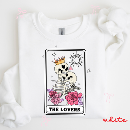 White sweatshirt with a skeleton couple and 'The Lovers' tarot card design on a white background.