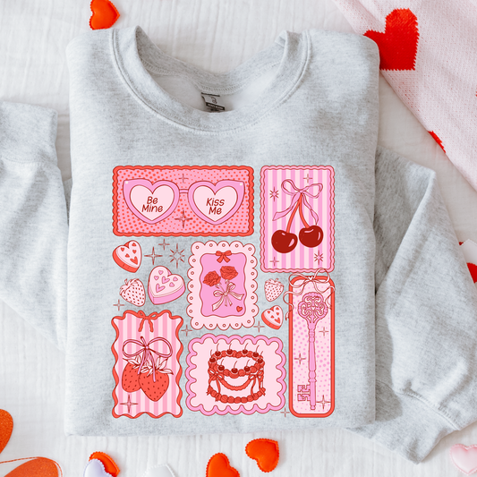 Gray sweatshirt with pink graphic designs on a white background