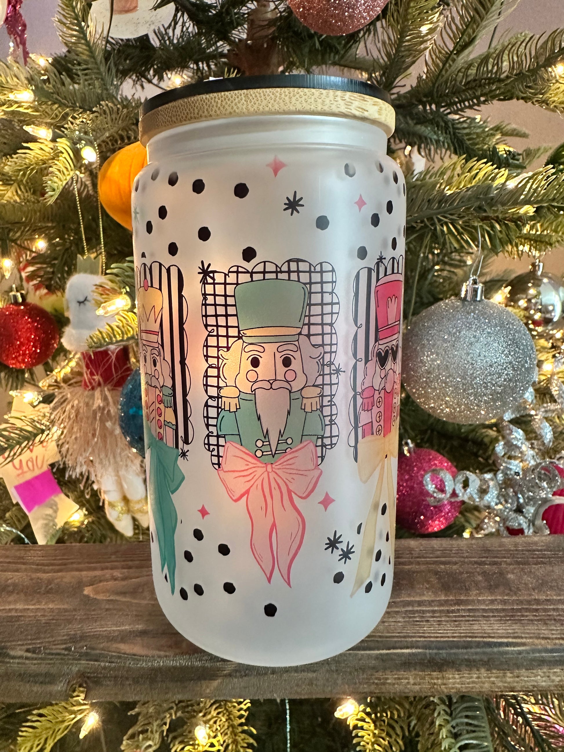 Pastel Nutcracker Christmas frosted glass can with two nutcracker designs, polka dots, and bamboo lid.
