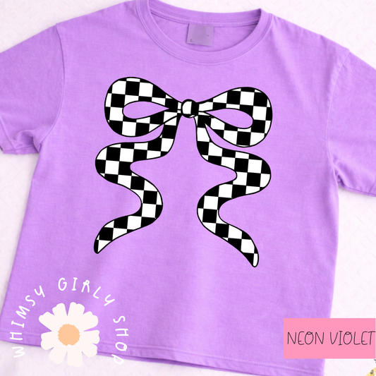 Purple t-shirt with a black and white checkered bow design on a white background