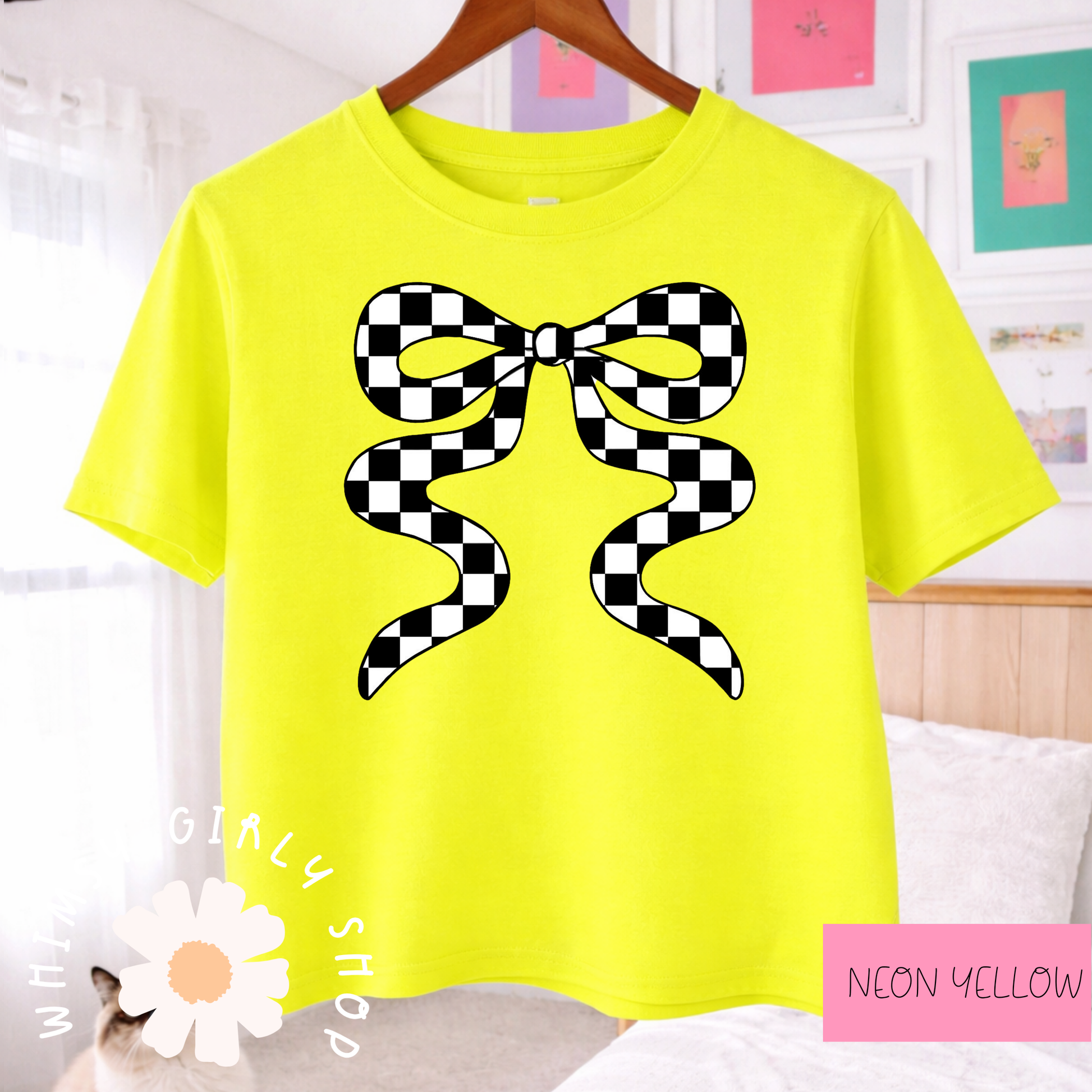 Neon yellow t-shirt with a black and white checkered bow design on a hanger.