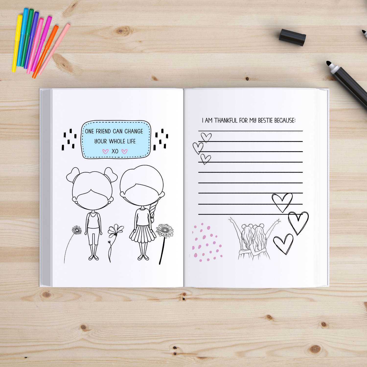 Open book with illustrated pages on a wooden surface with coloring supplies.