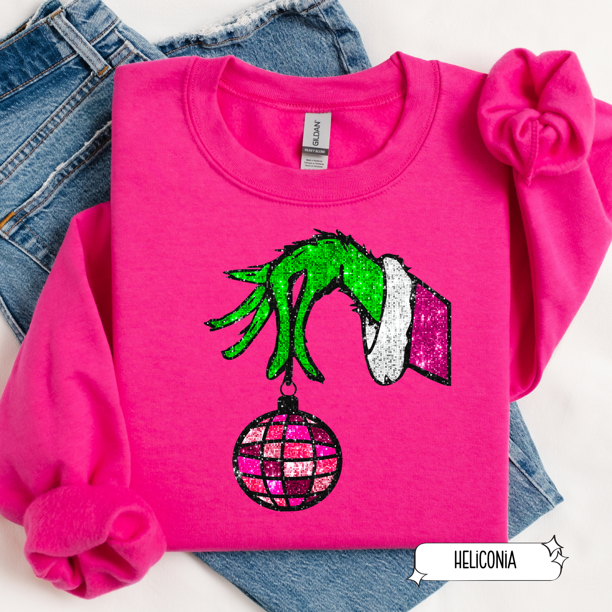 Holiday crewneck with Grinch hand and ornament graphic