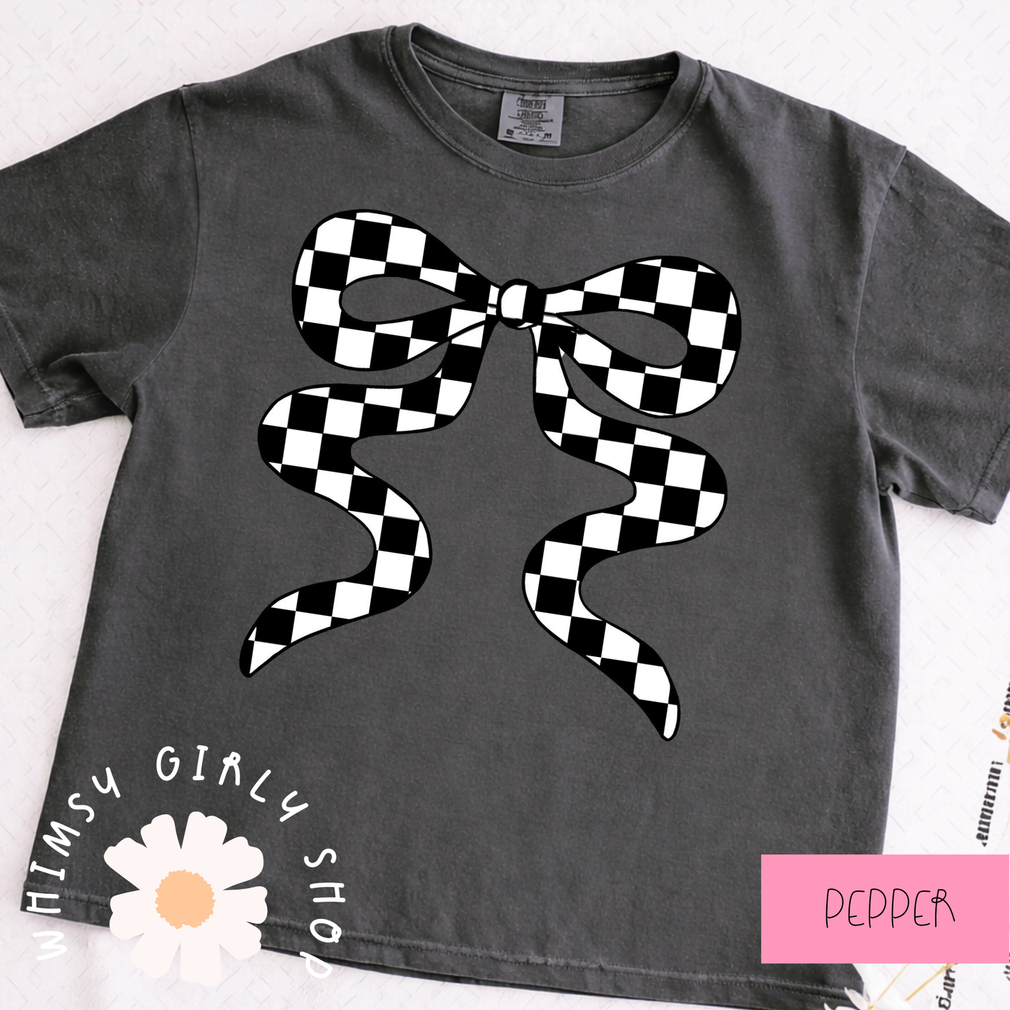 pepper t-shirt with a black and white checkered bow design on a white background