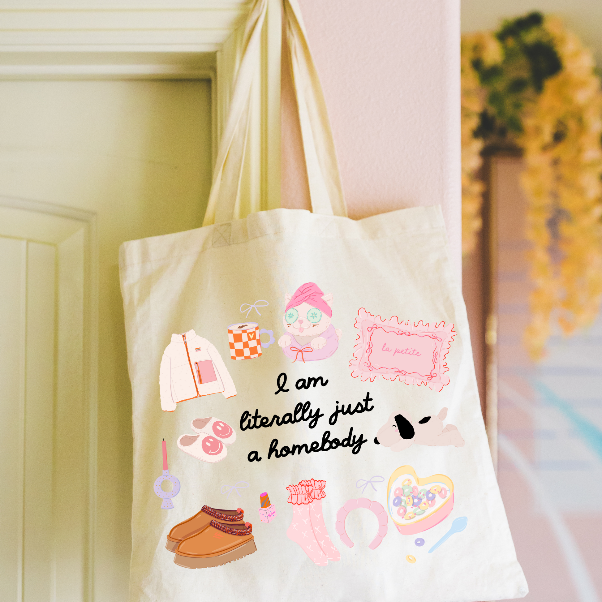 Close up of I Am Literally Just a Homebody tote design hanging from door