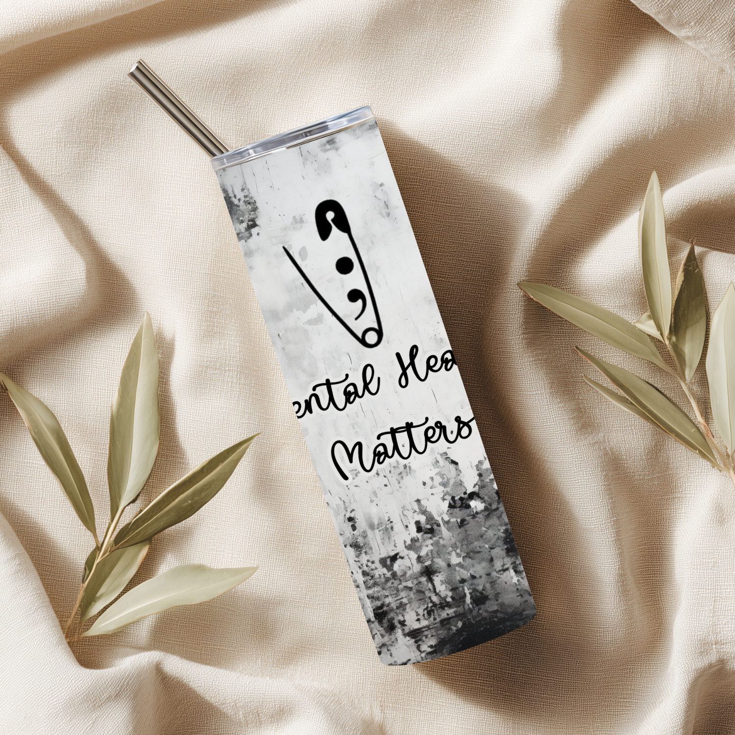 Tumbler with 'Mental Health Matters' design on a beige fabric background