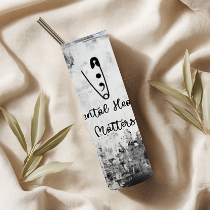 Tumbler with 'Mental Health Matters' design on a beige fabric background