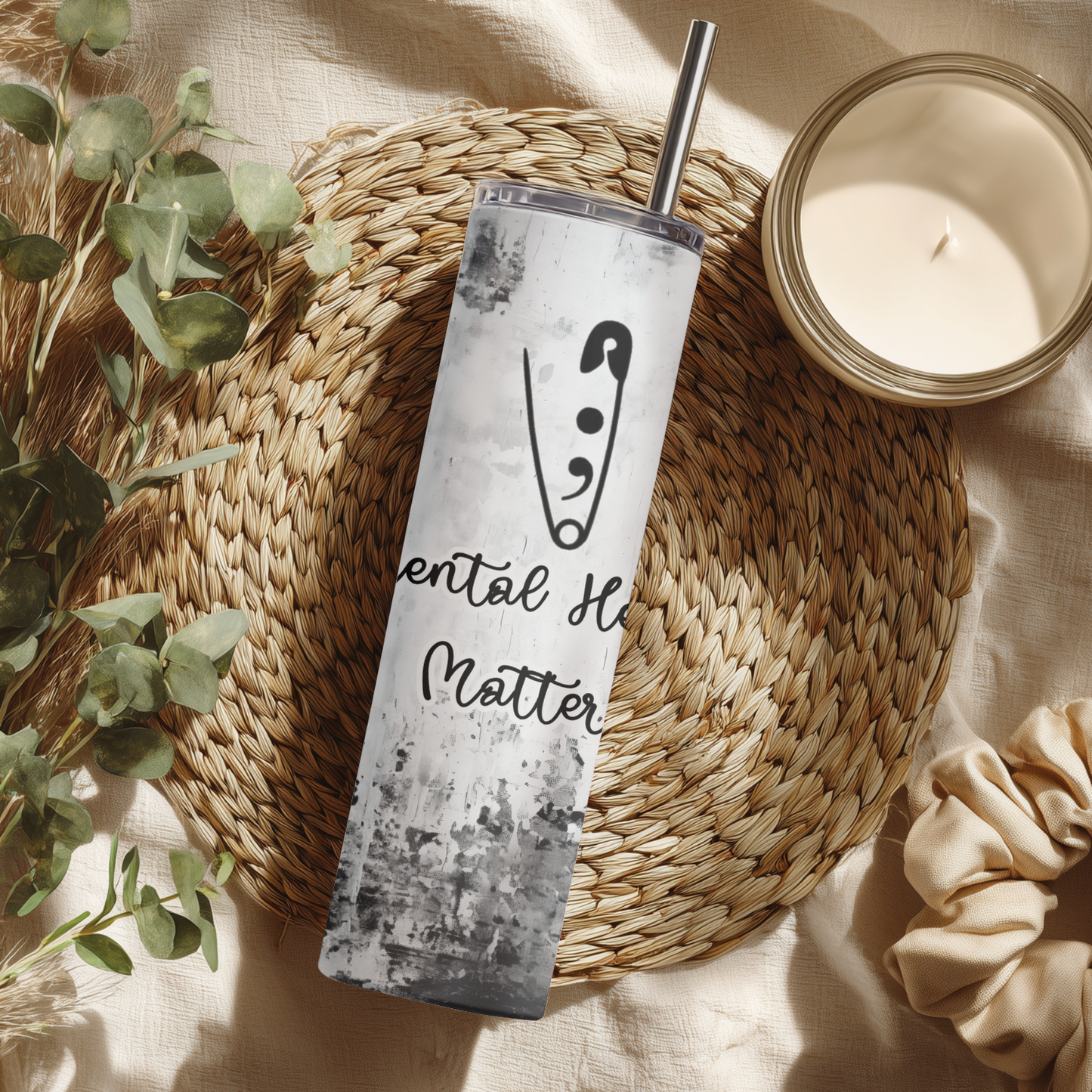 Mental Health Matters Daily Reminder Tumbler displayed on woven mat with plants and a candle.