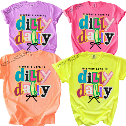 Four colorful t-shirts with 'dilly dally' text in neon colors on a white background.
