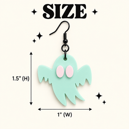 A mint green ghost-shaped dangle earring with pink eyes and a black hook, shown on a cream background with size annotations reading 1.5" (H) and 1" (W) under the word SIZE.