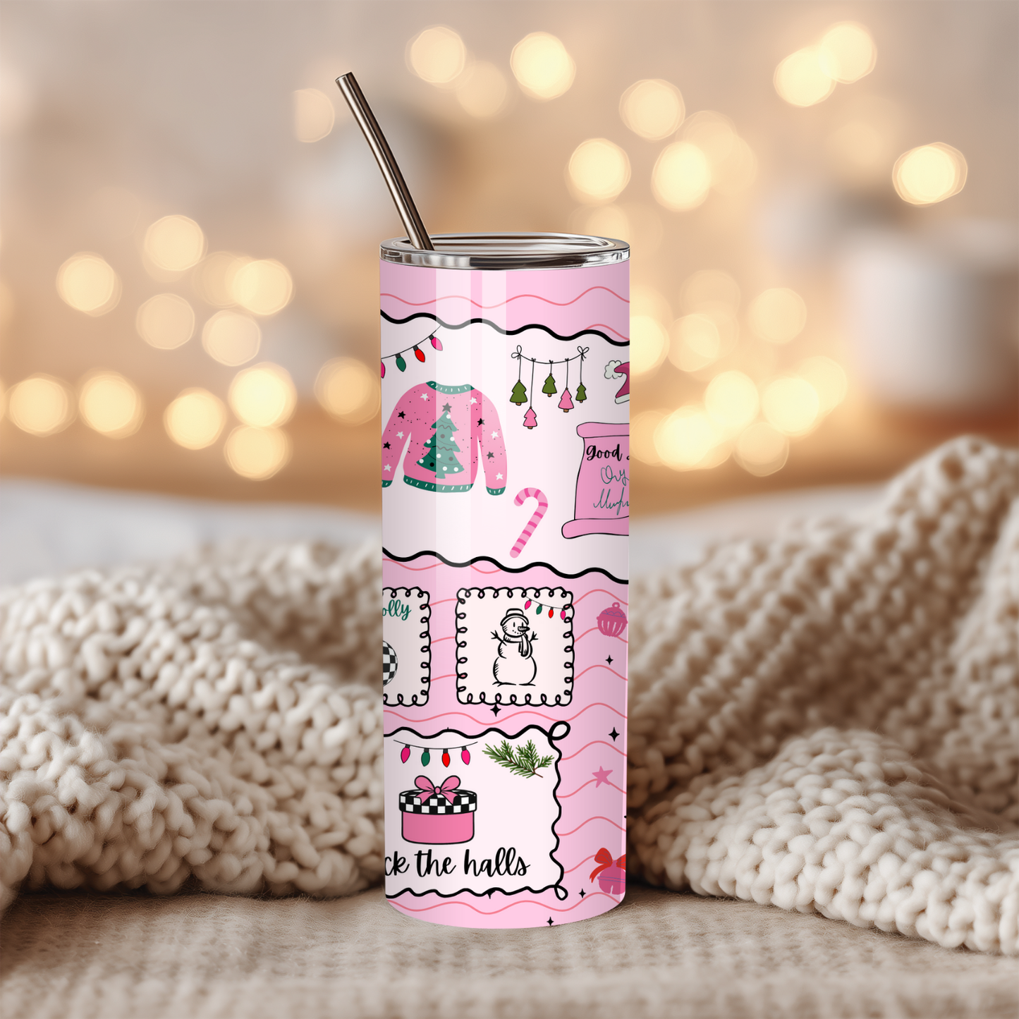 Tumbler with pink holiday design on a blurred background