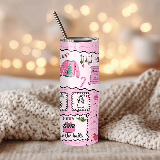 Tumbler with pink holiday design on a blurred background
