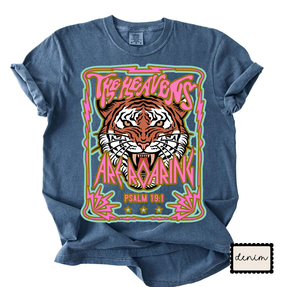 Denim t-shirt with a tiger graphic and text on a white background