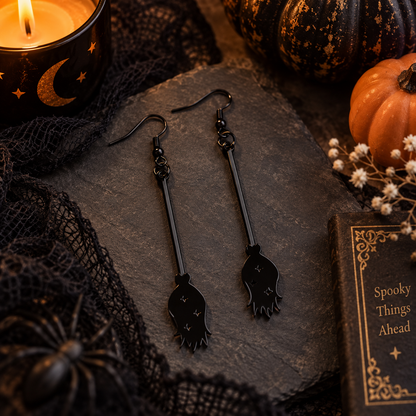 Black spooky dangle earrings Halloween flat lay