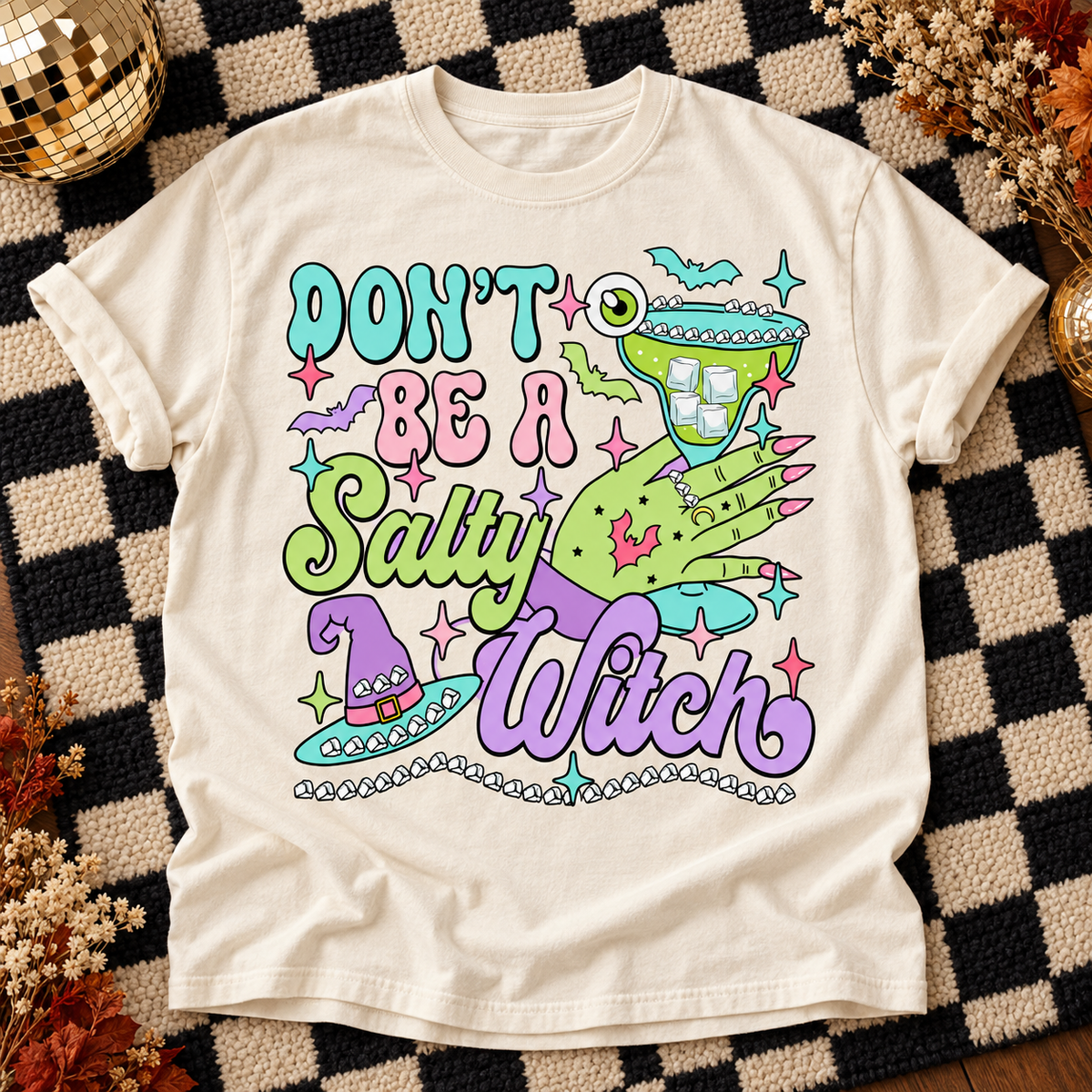 Ivory Don't Be a Salty Witch T-shirt with neon green witch hand, margarita glass and pastel lettering