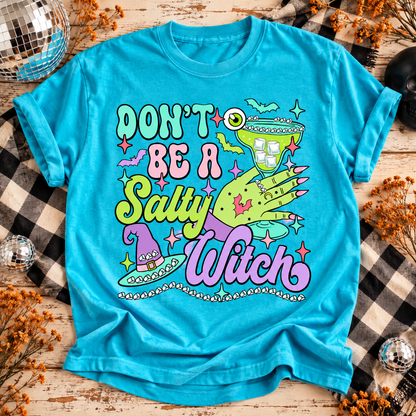 Lagoon Don't Be a Salty Witch T-shirt with neon green witch hand, margarita glass and pastel lettering