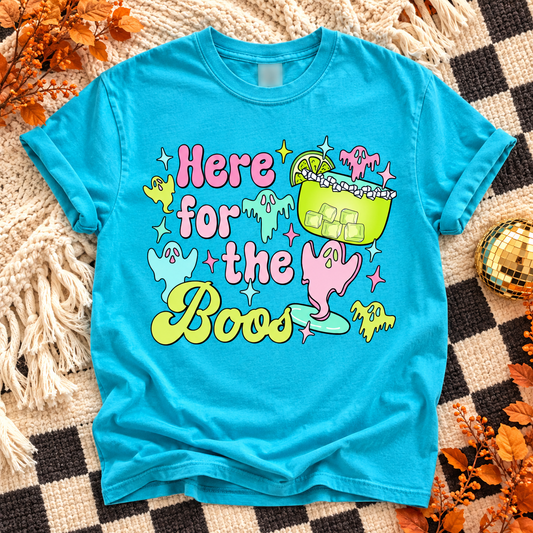 Lagoon Here for the Boos T-shirt with colorful ghosts and a Halloween drink on an autumn flat lay