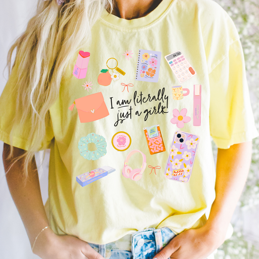 Person wearing Yellow Literally Just a Girl graphic tee with pastel girly doodles and cute casual style