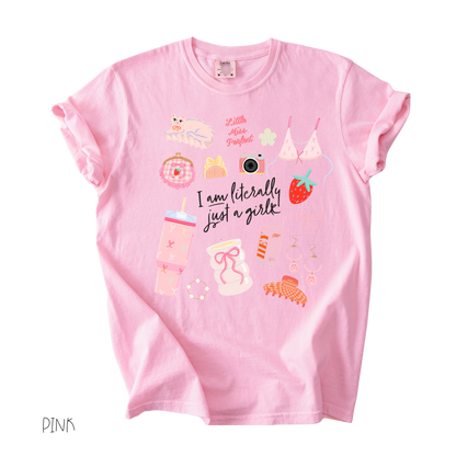 Literally Just a Girl graphic t-shirt featuring pastel girly icons, bows, camera, and cute aesthetic illustrations