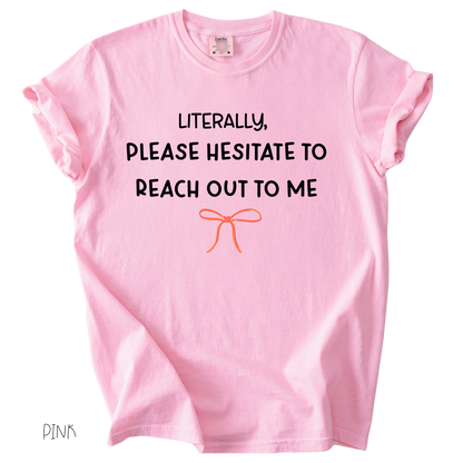 Funny girly graphic tee that says literally please hesitate to reach out to me on pink shirt