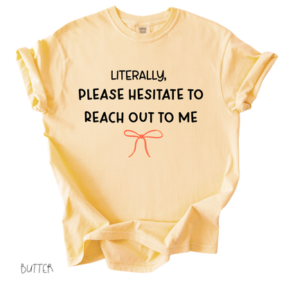 Funny girly graphic tee that says literally please hesitate to reach out to me on butter colored shirt