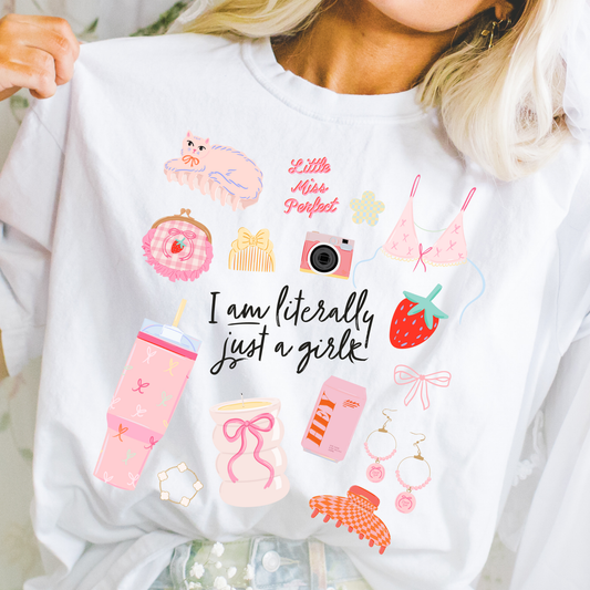 Woman wearing “Literally Just a Girl” graphic t-shirt with playful pastel icons and feminine doodle design
