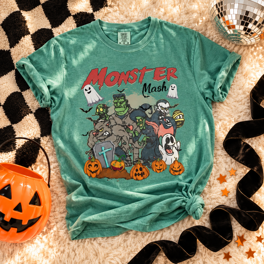 Light Green T-shirt featuring Vintage Monster Mash Halloween characters graphic on a Halloween flat lay