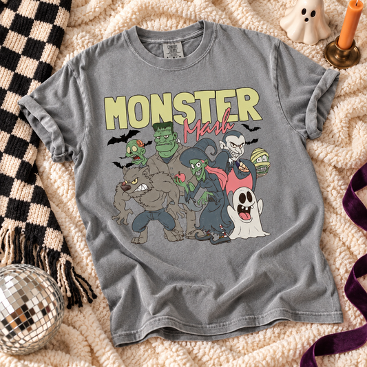Gray T-shirt featuring Monster Mash Halloween characters graphic on a checkered throw