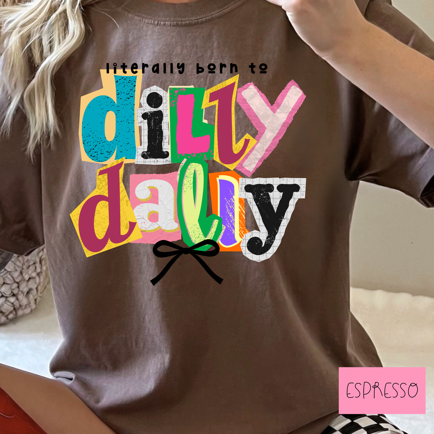 Brown t-shirt with colorful 'dilly dally' text and a bow, labeled 'Espresso'.