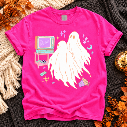Neon Pink T-shirt with three white ghosts beside a pastel retro TV labeled The Paranormal