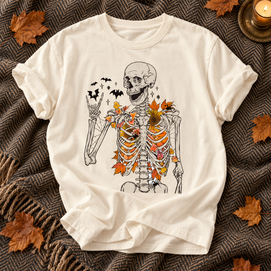 Ivory T-shirt featuring Floral Skeleton fall graphic on an autumn flat lay