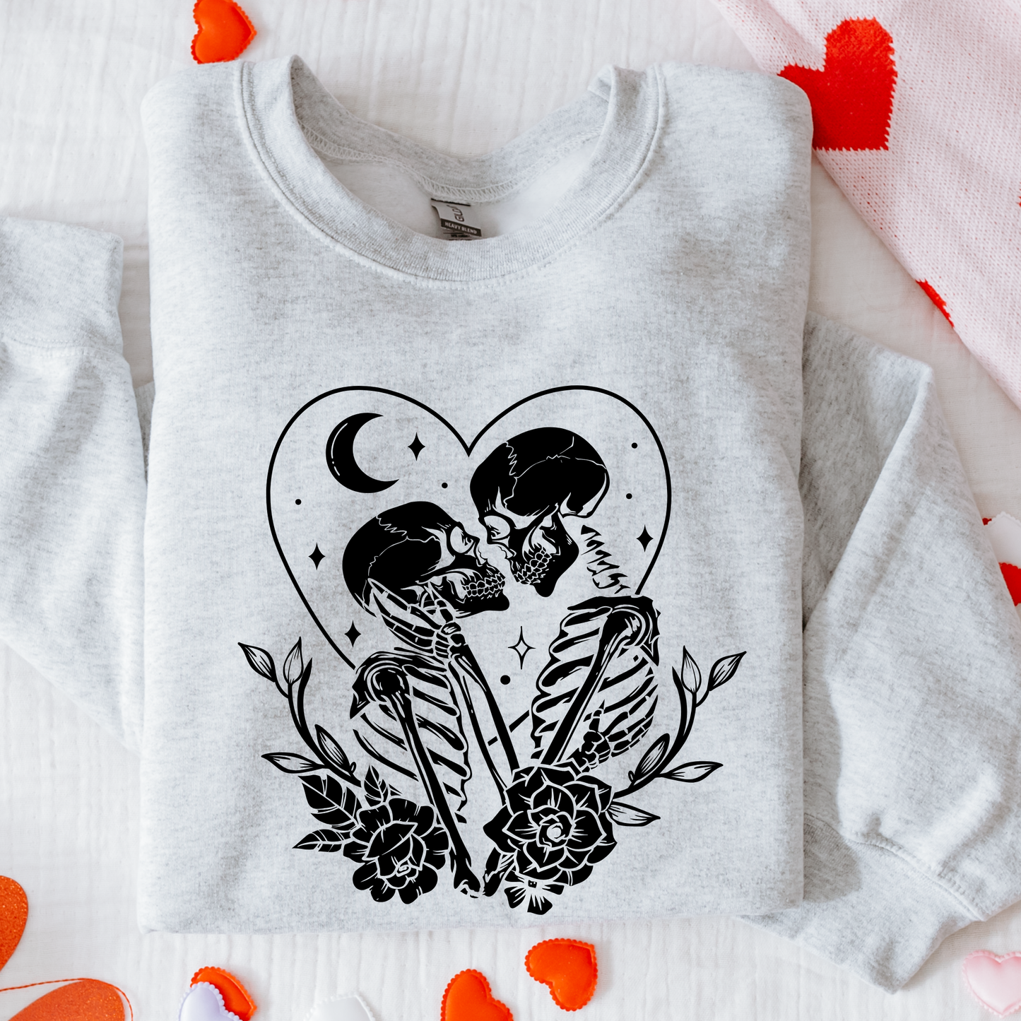 Gray sweatshirt with black skeleton design on a white background